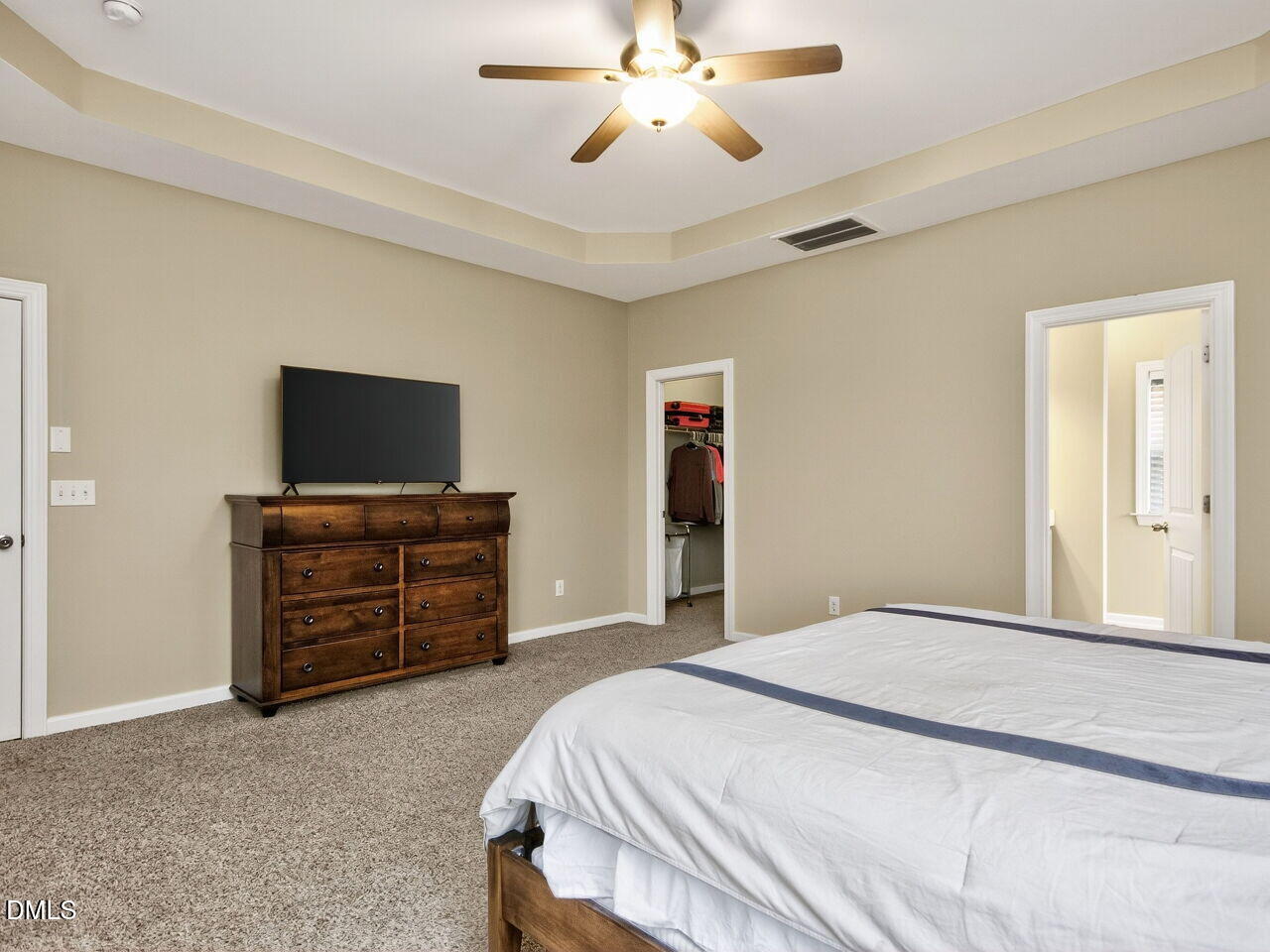 1133 Chapanoke Road Raleigh, NC 27603 - Photo 19 of 48 a bedroom with a bed and a flat screen tv