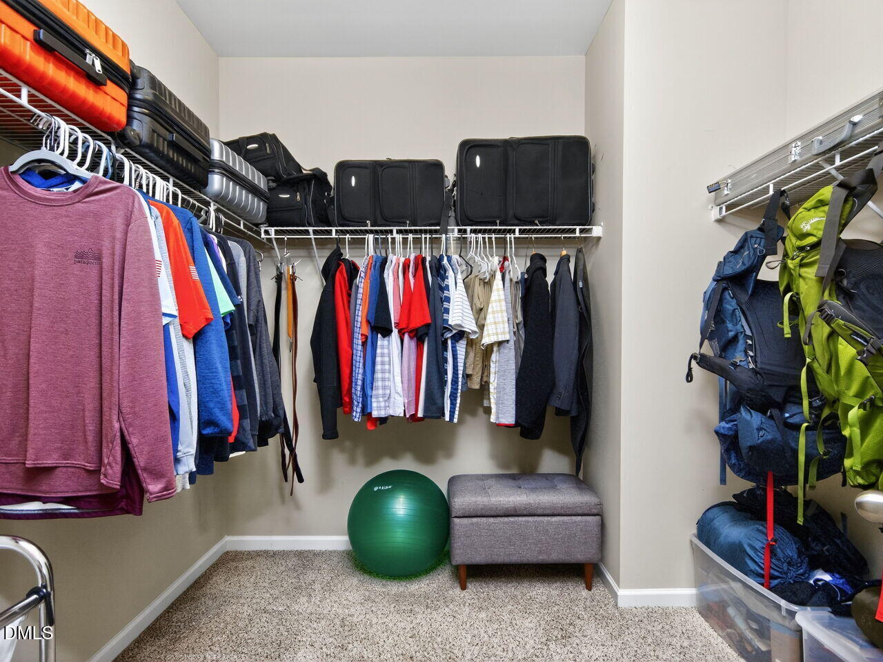 1133 Chapanoke Road Raleigh, NC 27603 - Photo 23 of 48 a view of walk in closet with clothes and shoes