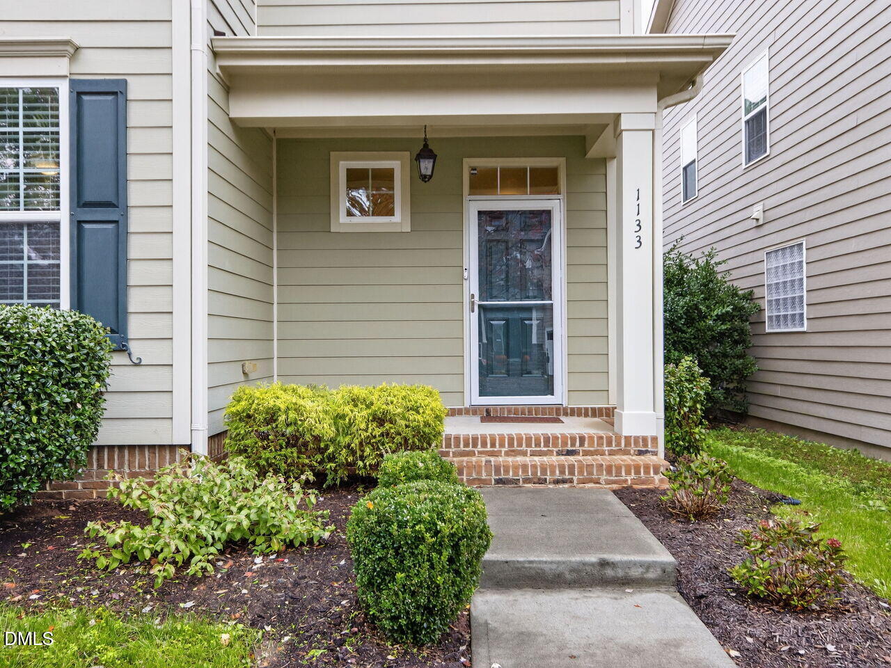 1133 Chapanoke Road Raleigh, NC 27603 - Photo 3 of 48 a front view of a house with a yard and plants