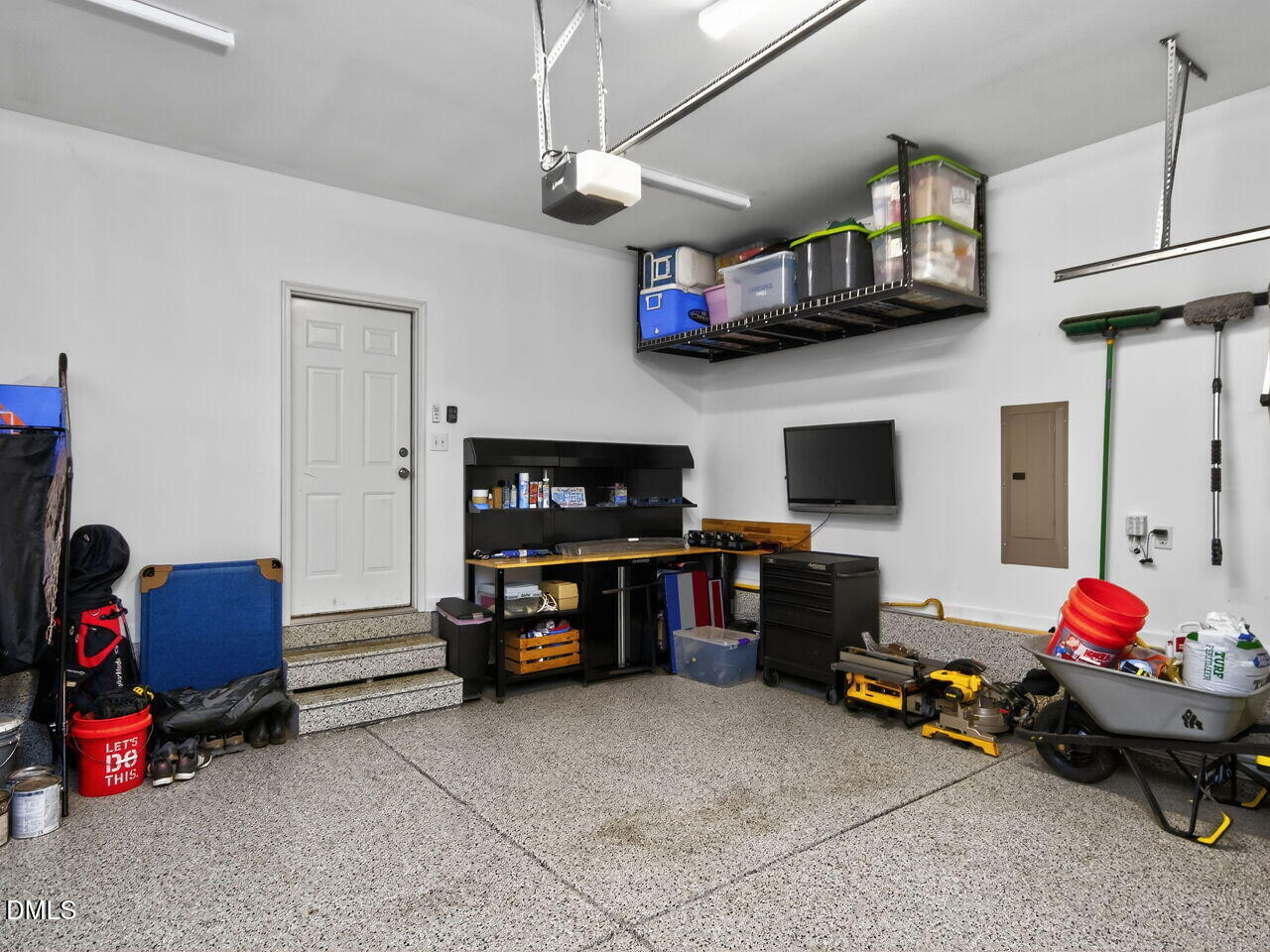 1133 Chapanoke Road Raleigh, NC 27603 - Photo 36 of 48 a living room with furniture and a flat screen tv
