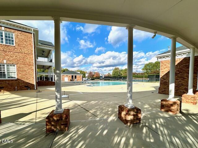 1133 Chapanoke Road Raleigh, NC 27603 - Photo 42 of 48 a view of a patio with table and chairs next to a yard