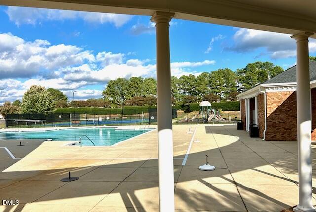 1133 Chapanoke Road Raleigh, NC 27603 - Photo 43 of 48 a view of a swimming pool with a patio