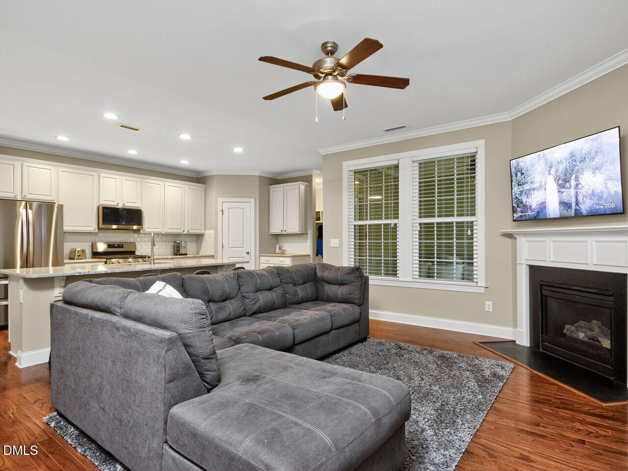1133 Chapanoke Road Raleigh, NC 27603 - Photo 8 of 48 a living room with furniture kitchen and a fireplace