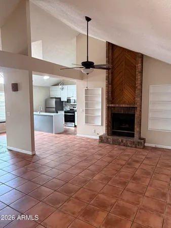 a view of a kitchen with a sink and a fireplace