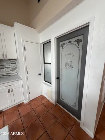 a view of a refrigerator in kitchen and wooden floor