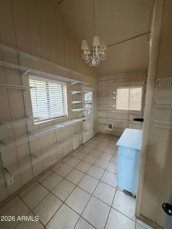 a bathroom with a granite countertop sink a toilet and mirror