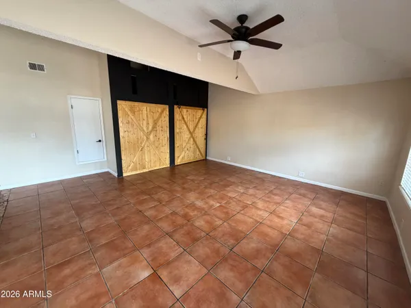 a view of an empty room and window