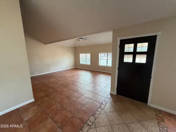 a view of an empty room and window