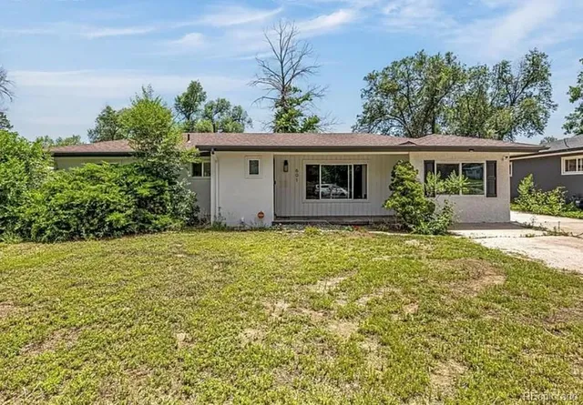 front view of a house with a yard