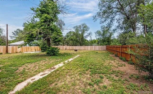 a view of backyard with green space