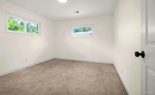 an empty room with windows