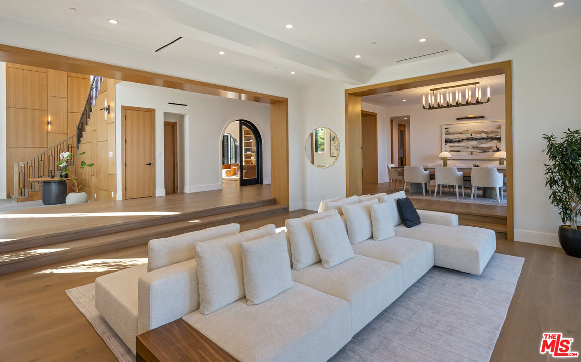 7052 Dume Drive Malibu, CA 90265 - Photo 11 of 52 a living room with furniture and a large window