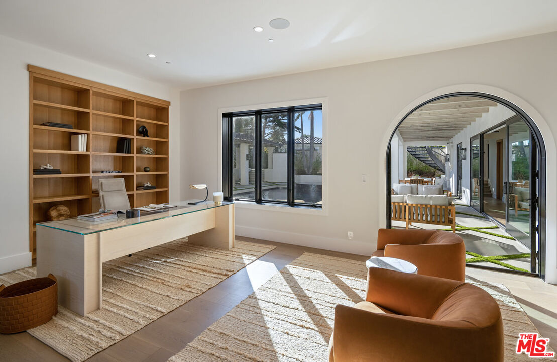 7052 Dume Drive Malibu, CA 90265 - Photo 22 of 52 a living room with furniture and a large window
