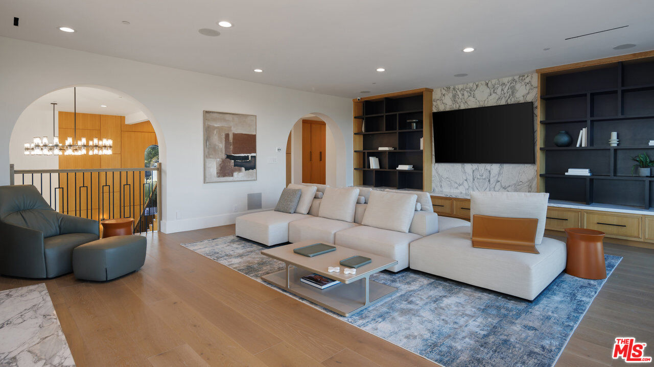7052 Dume Drive Malibu, CA 90265 - Photo 41 of 52 a living room with furniture and a flat screen tv
