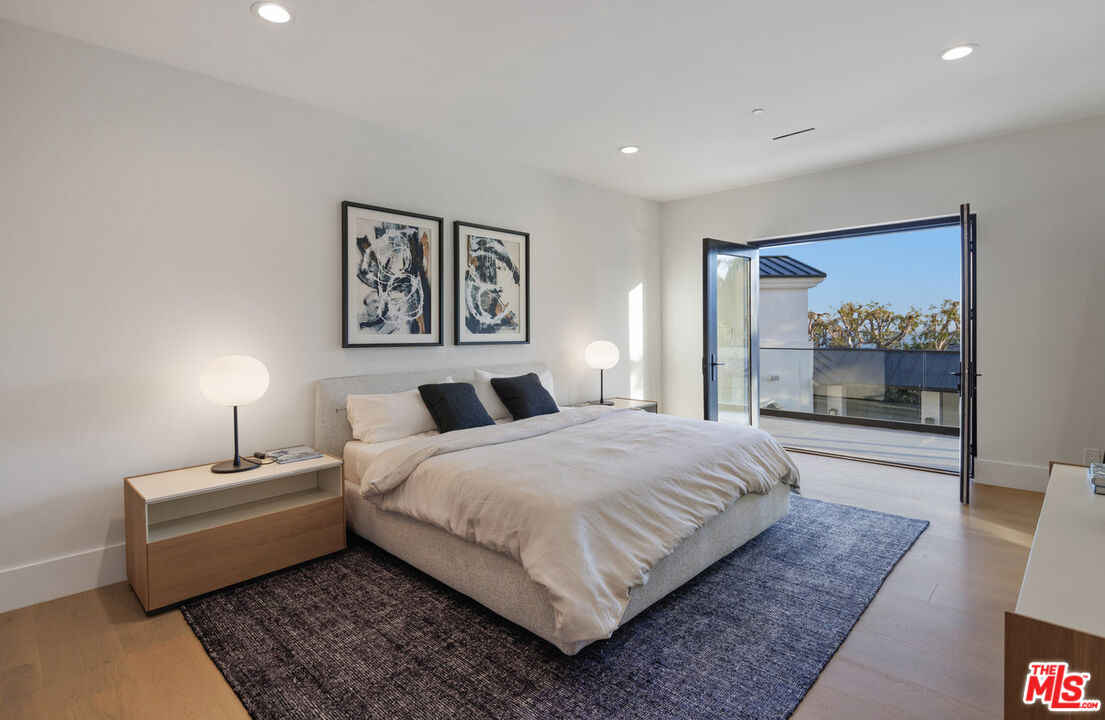 7052 Dume Drive Malibu, CA 90265 - Photo 43 of 52 a bedroom with a large bed and a couch