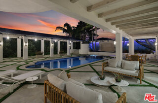 7052 Dume Drive Malibu, CA 90265 - Photo 50 of 52 a view of a house with patio outdoor seating