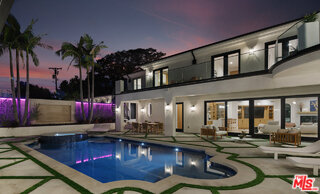 7052 Dume Drive Malibu, CA 90265 - Photo 51 of 52 a view of a swimming pool with outdoor seating