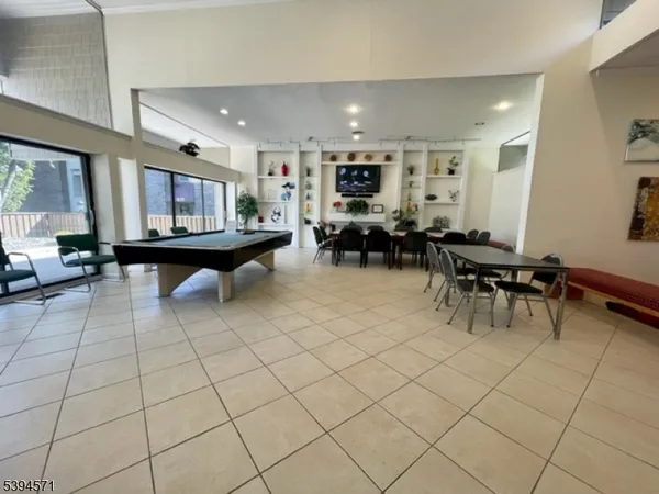 a living room with furniture a table and chairs