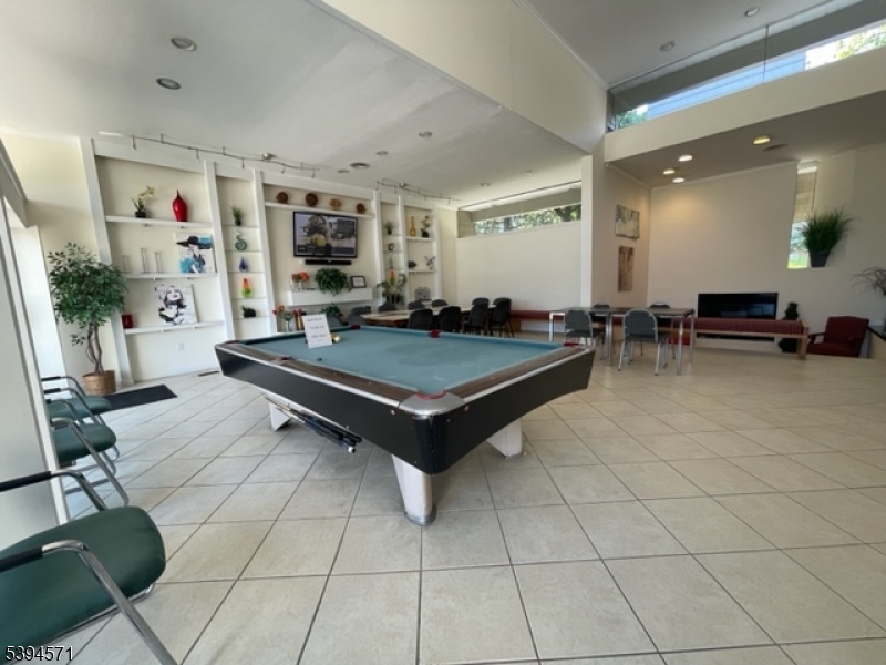 6 River Road, Unit K Nutley, NJ 07110 - Photo 20 of 21 a living room with furniture a table and chairs
