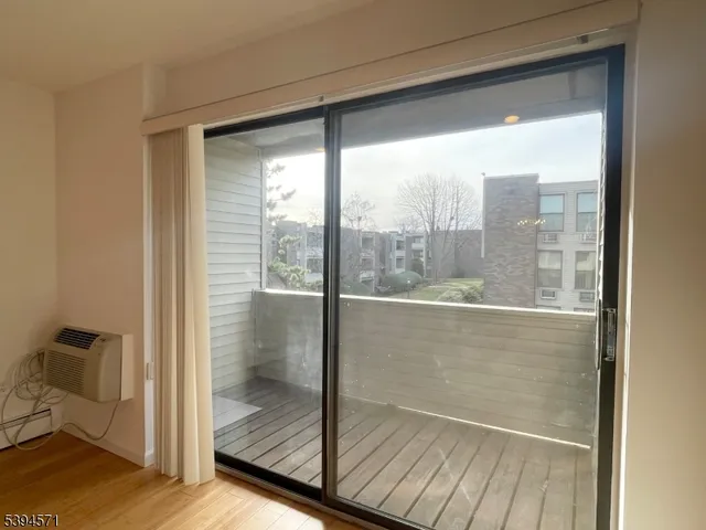 a bathroom with a glass door and shower