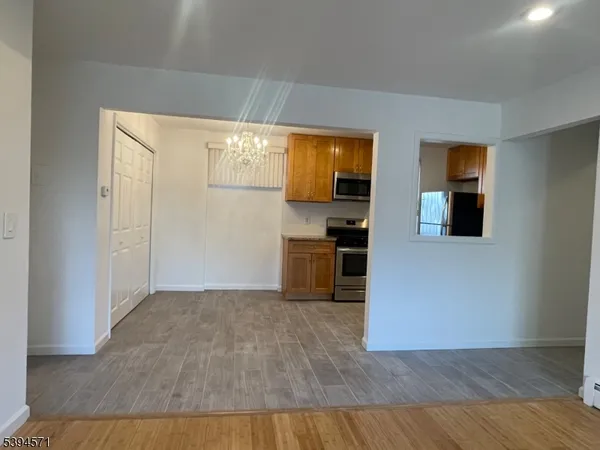a view of a kitchen cabinets and wooden floor