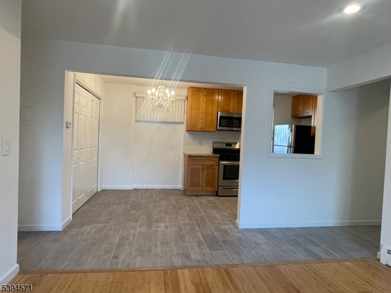 6 River Road, Unit K Nutley, NJ 07110 - Photo 10 of 21 a view of a kitchen cabinets and wooden floor