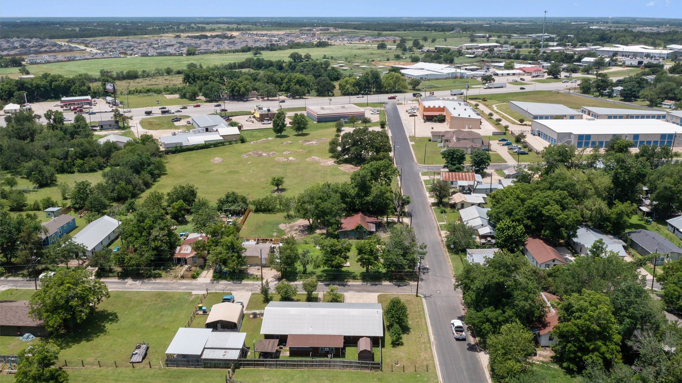 503 West Alamo Street Elgin, TX 78621 - Photo 6 of 11 an aerial view of a house with a garden