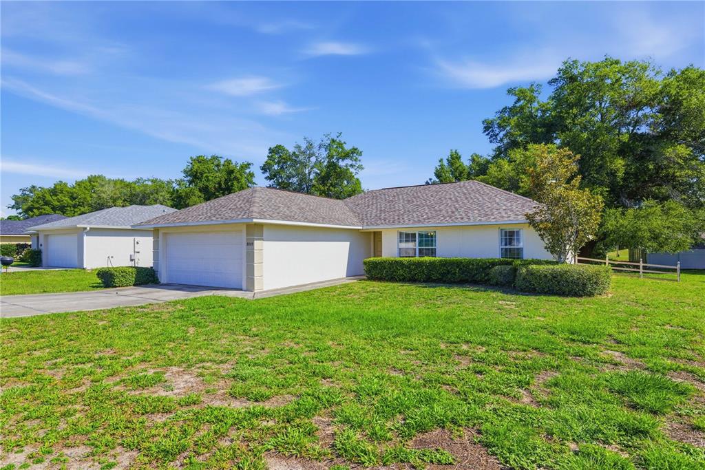 3959 Southwest 129th Street Ocala, FL 34473 - Photo 26 of 27 a view of a yard in front of a house with a big yard