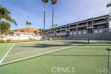 a view of a lake with houses in the background