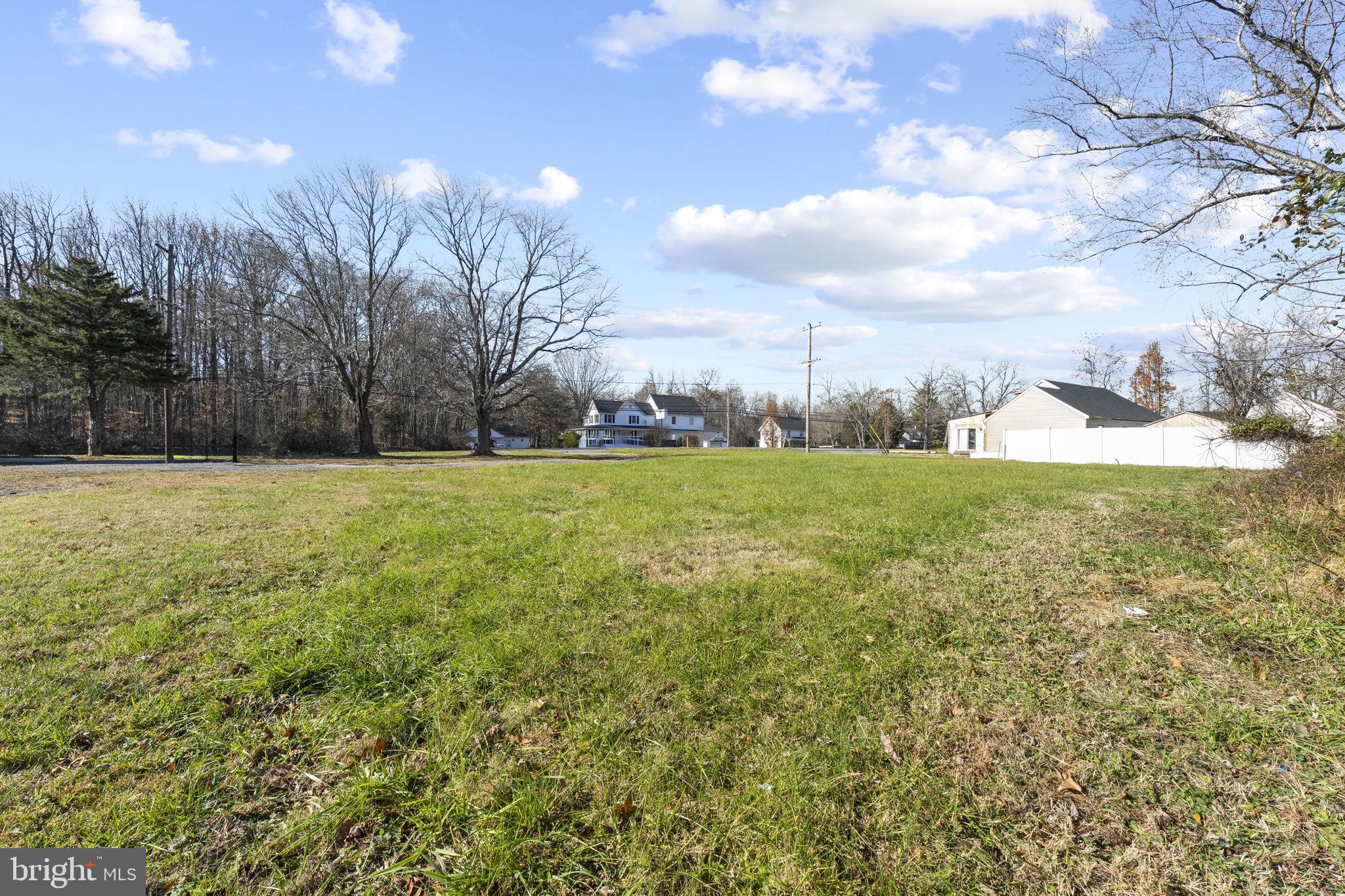 5-6 Singerly Road Elkton, MD 21921 - Photo 2 of 6 a view of a grassy field with trees in the background