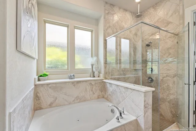 a bathroom with a bathtub and window