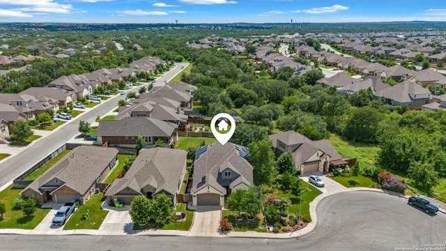 an aerial view of a house with a garden