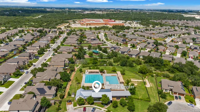 an aerial view of residential houses with outdoor space