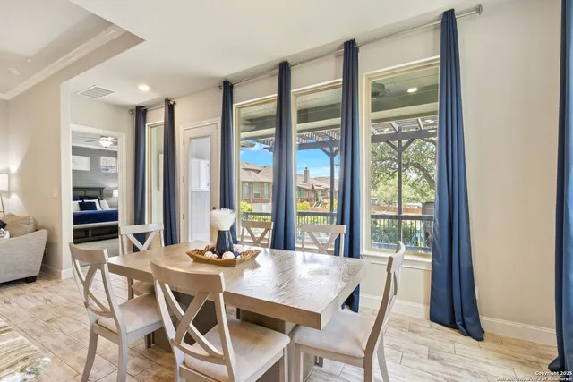 a dining room with furniture and window