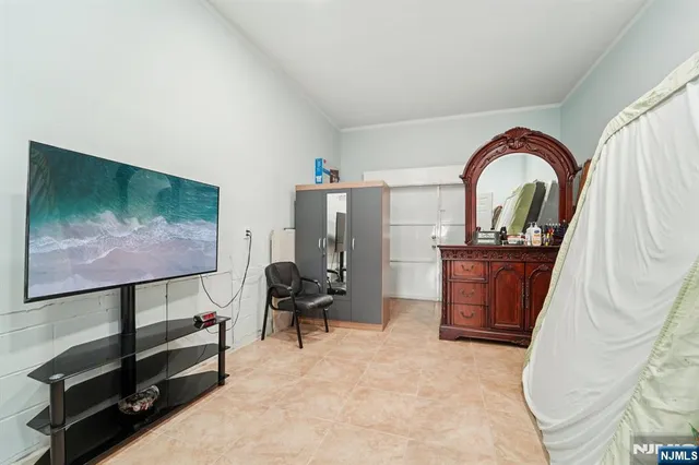 a view of a livingroom with furniture and workspace