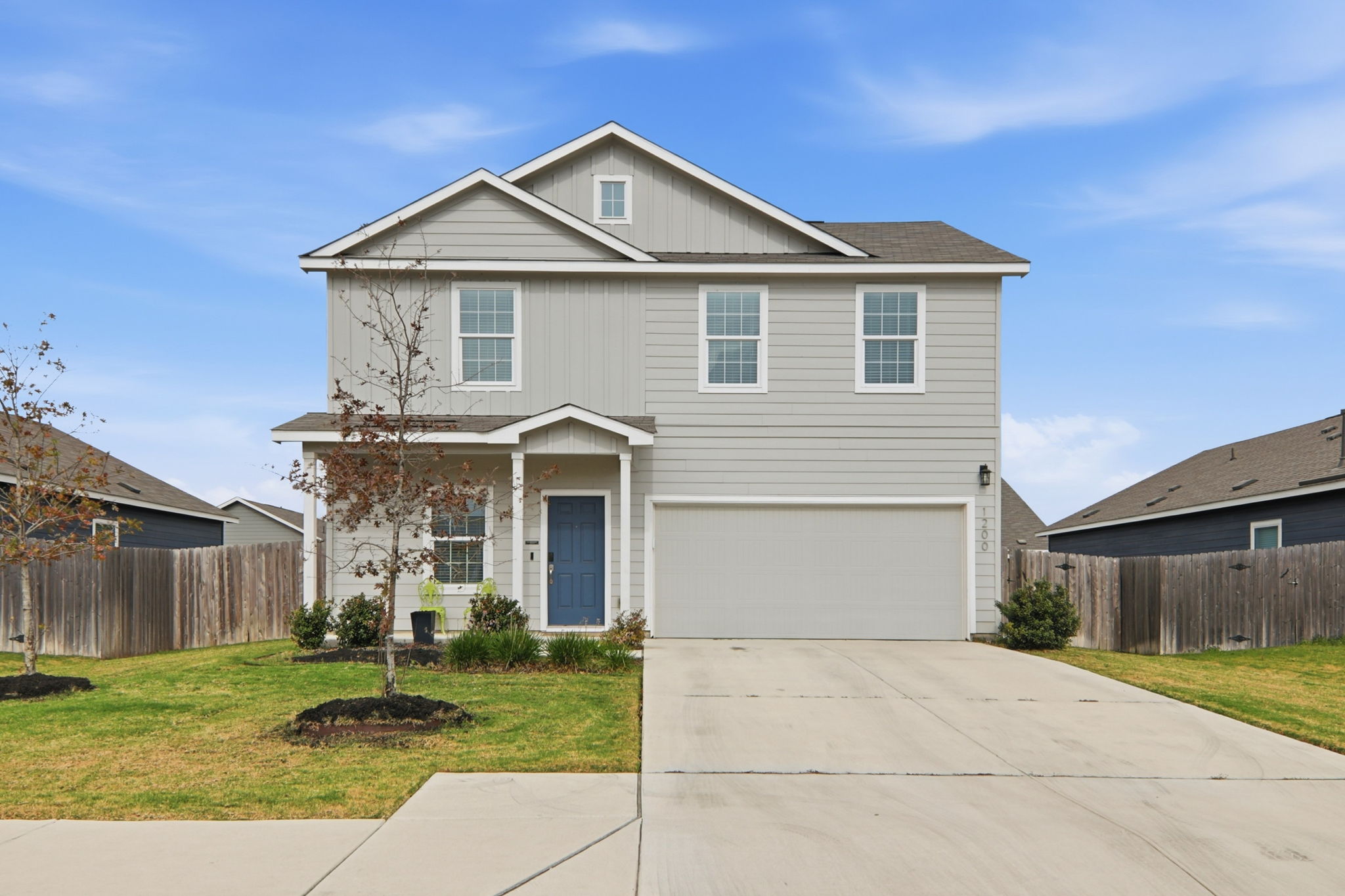 1200 Rio Frio Lane Georgetown, TX 78626 - Photo 1 of 25 Traditional home featuring a garage, driveway, and board and batten siding