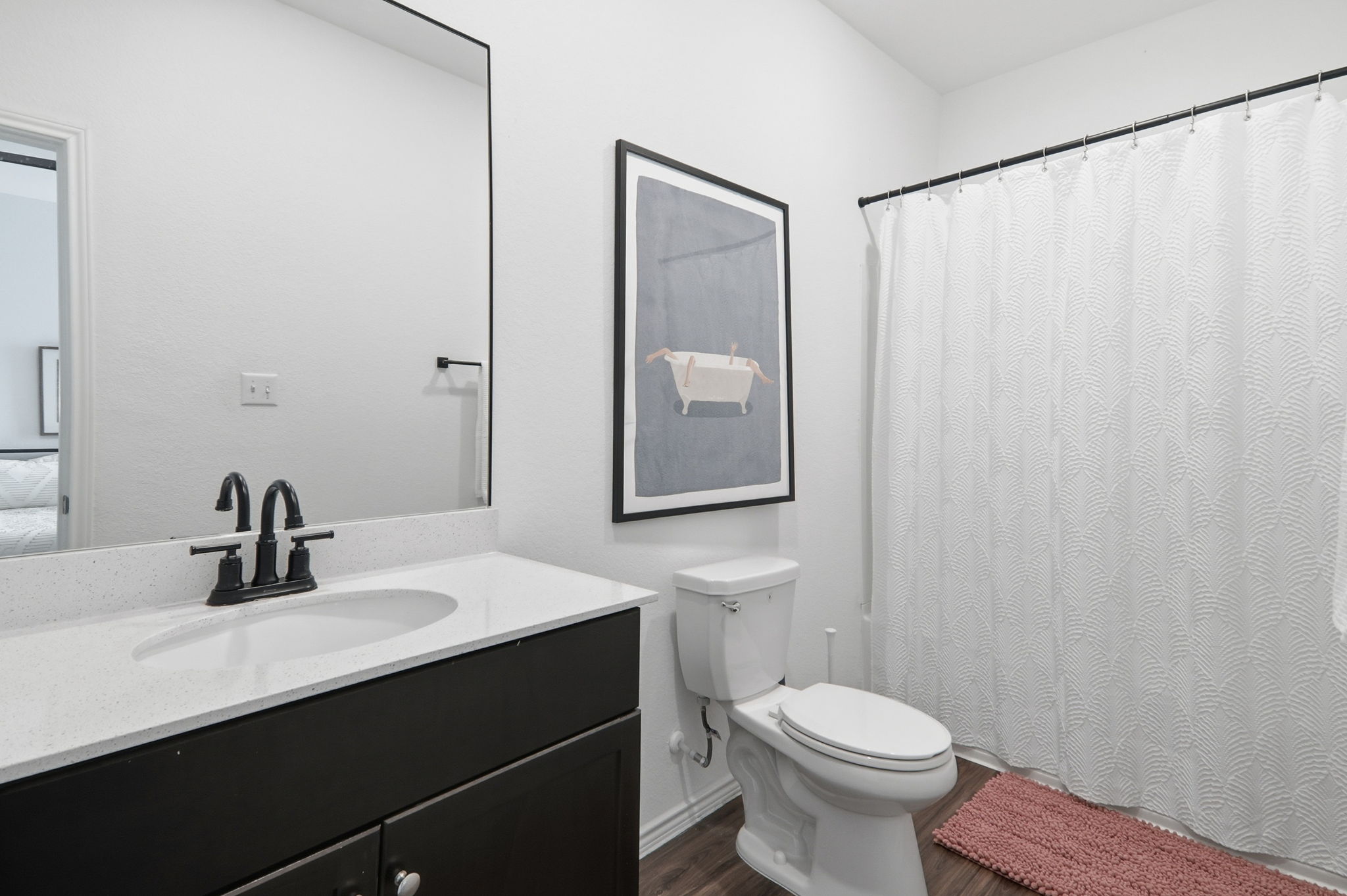 1200 Rio Frio Lane Georgetown, TX 78626 - Photo 17 of 25 Full bath with vanity, a shower with curtain, and dark wood-style floors