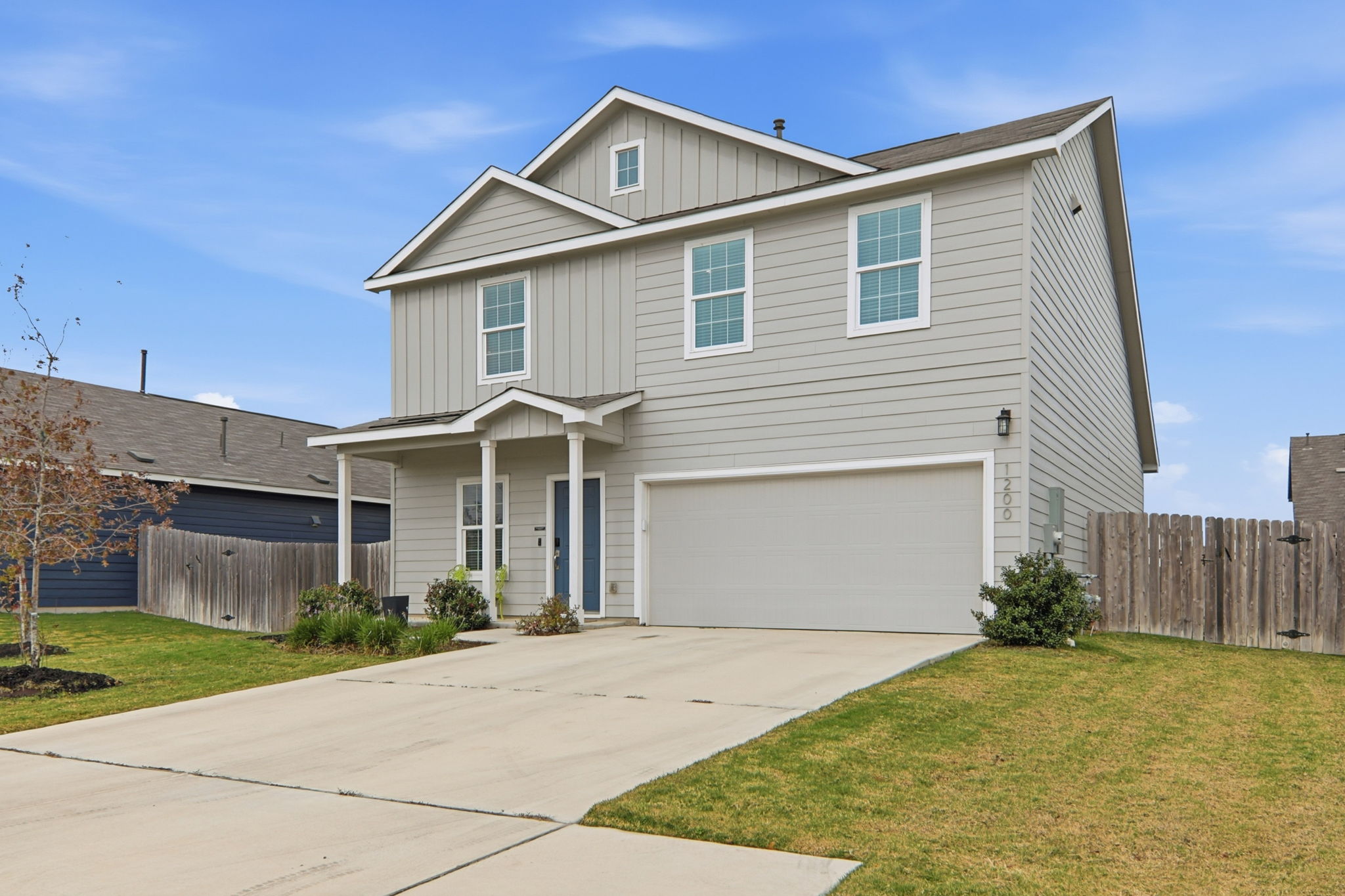 1200 Rio Frio Lane Georgetown, TX 78626 - Photo 2 of 25 Traditional home with board and batten siding, a garage, and driveway