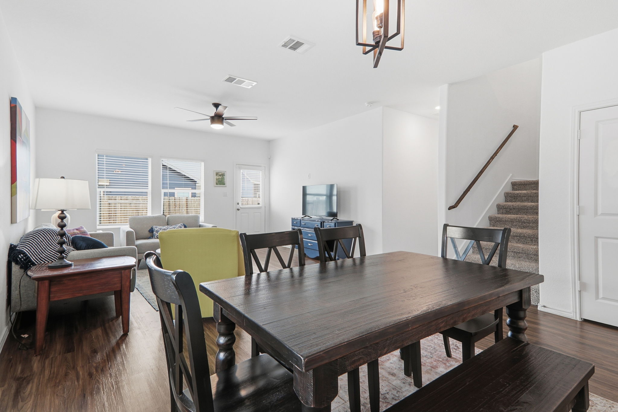 1200 Rio Frio Lane Georgetown, TX 78626 - Photo 9 of 25 Dining space with dark wood-style flooring, stairs, and ceiling fan