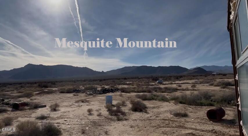 91525 Palm Road Baker, CA 92309 - Photo 13 of 39 a view of a street with a large barn