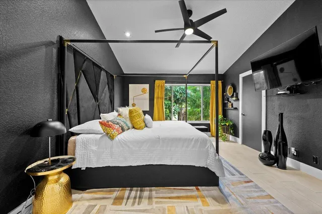 a bed room with a bed window and a rug