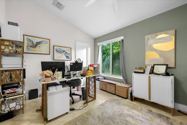 a workspace with furniture and a window