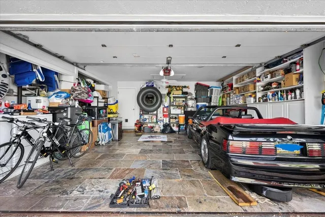 a bathroom with a double vanity sink mirror and bathtub