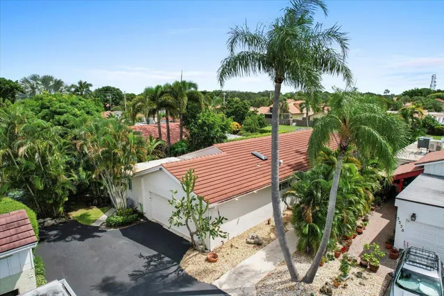 an aerial view of house with yard