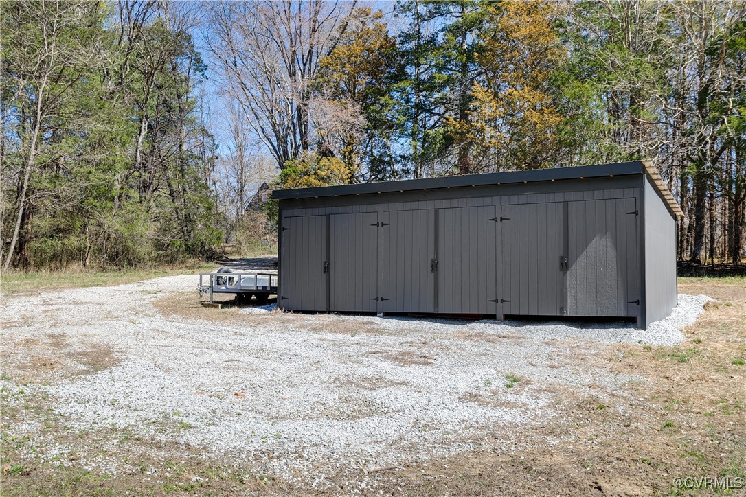 14 Ca Ira Road Cumberland, VA 23040 - Photo 38 of 43 a view of backyard with wooden fence and a bench