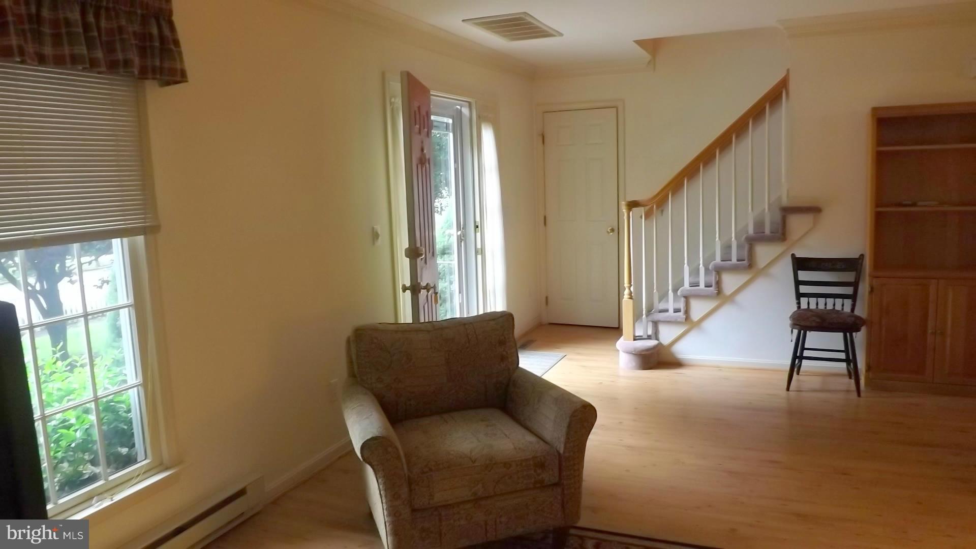 103 Douglas Ln Street St. Michaels, MD 21663 - Photo 13 of 28 a living room with furniture and a large window