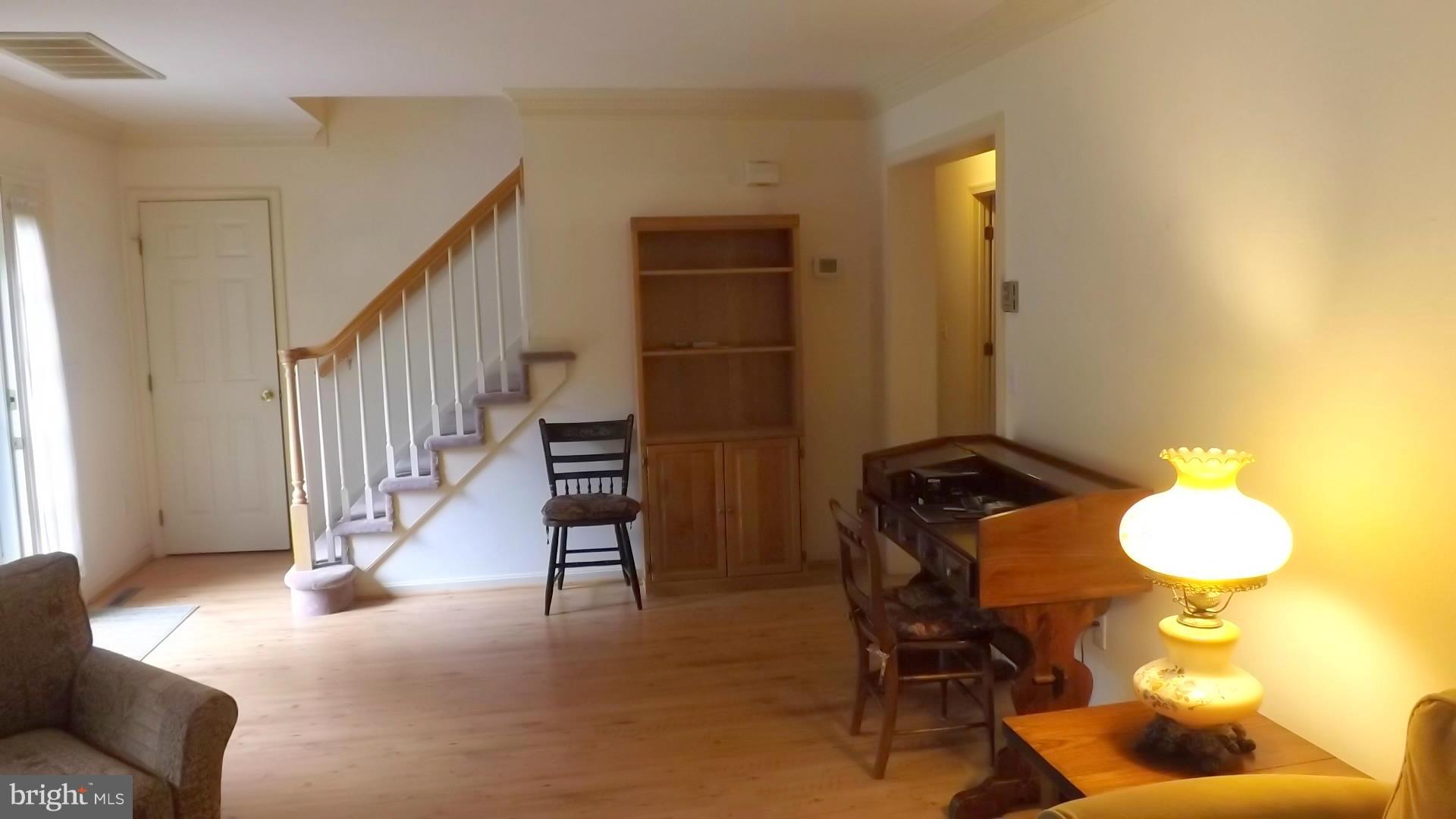103 Douglas Ln Street St. Michaels, MD 21663 - Photo 14 of 28 a view of a livingroom with furniture and stairs