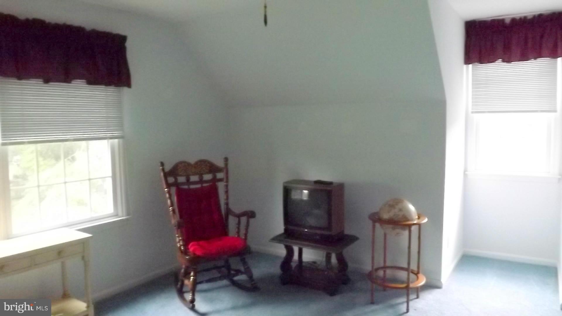 103 Douglas Ln Street St. Michaels, MD 21663 - Photo 20 of 28 a living room with furniture a window and a couch