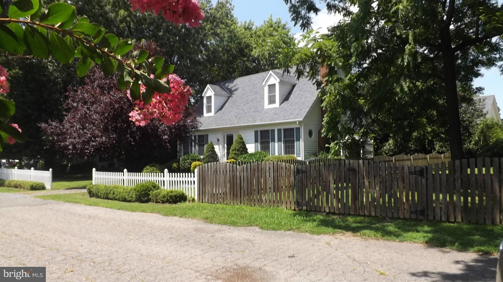 103 Douglas Ln Street St. Michaels, MD 21663 - Photo 27 of 28 a front view of a house with a garden