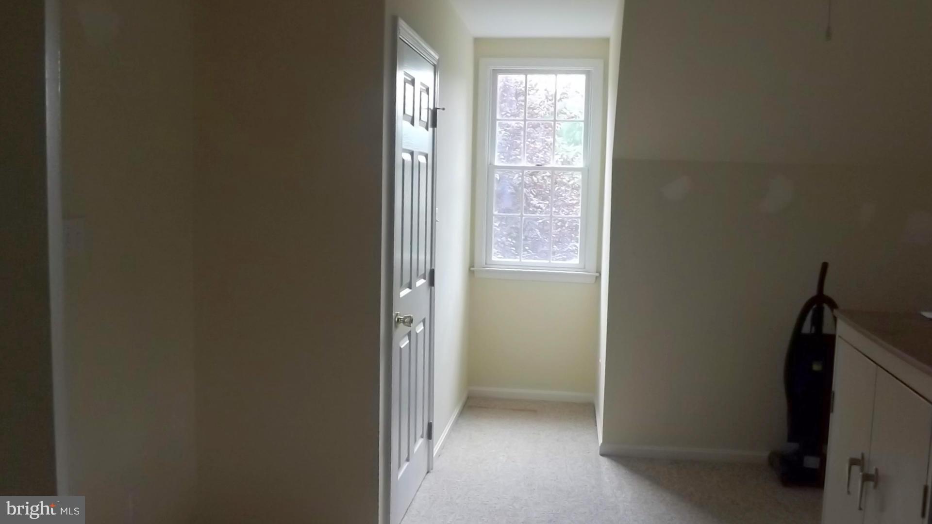 103 Douglas Ln Street St. Michaels, MD 21663 - Photo 5 of 28 a view of an empty room and window